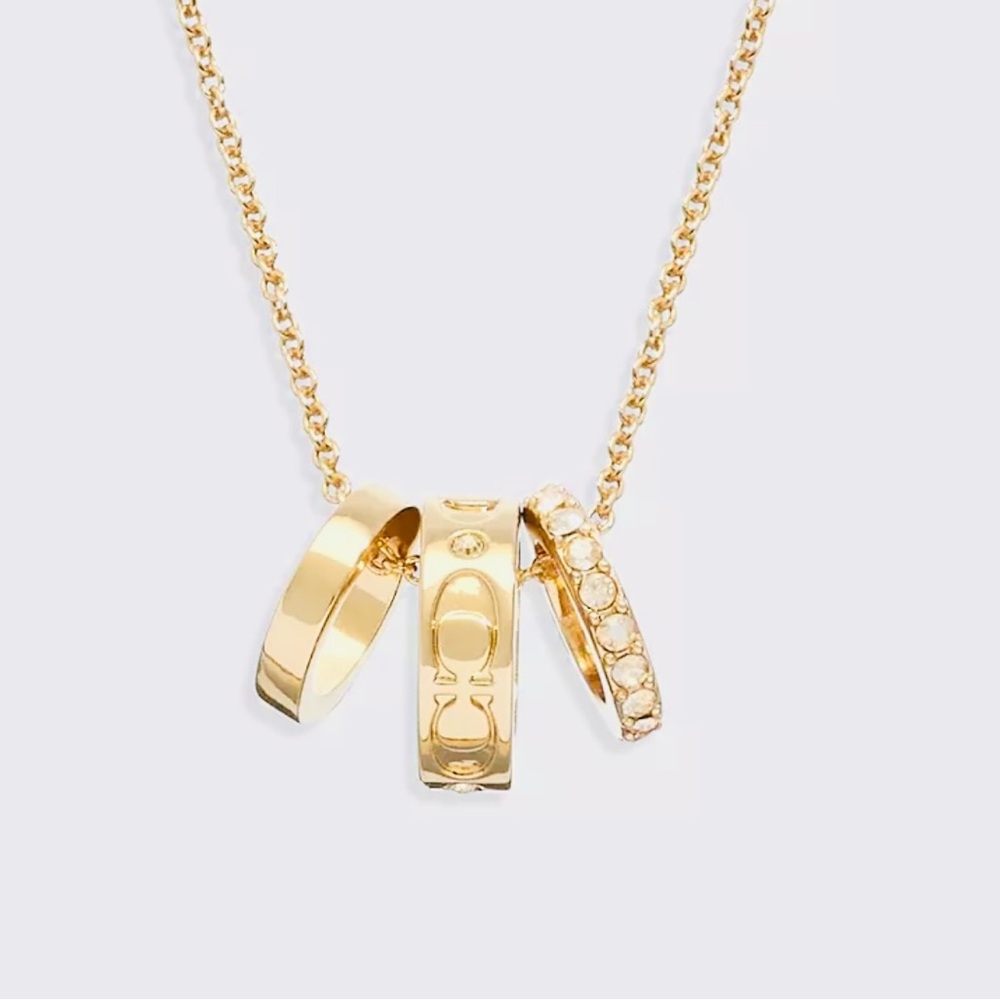 Elegant Gold Necklace with Triple Ring Pendant